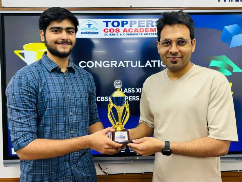 Ranveer Singh presenting a trophy to a class topper